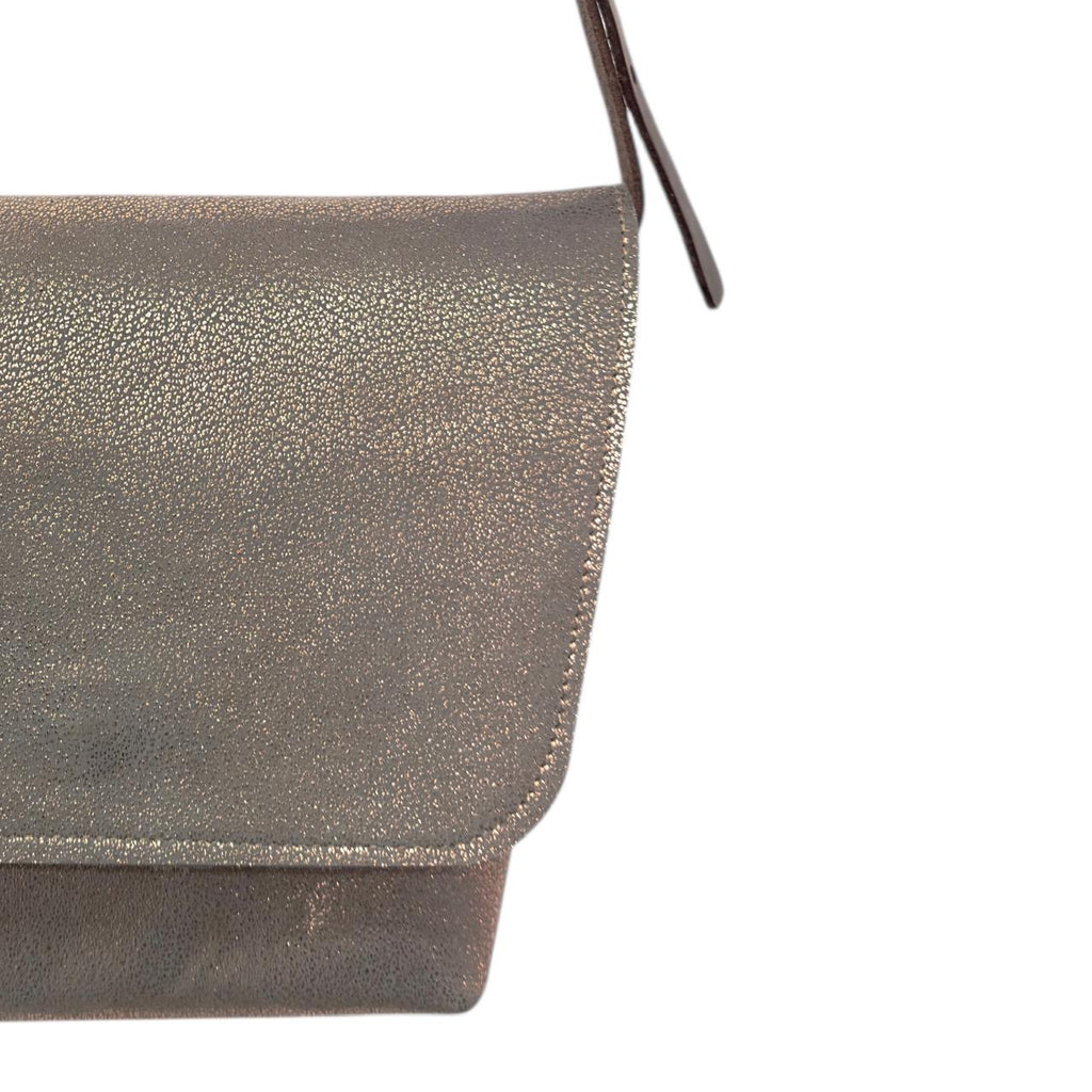 Bolso Nómada rosa metálico textura